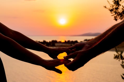 Hands holding sunset