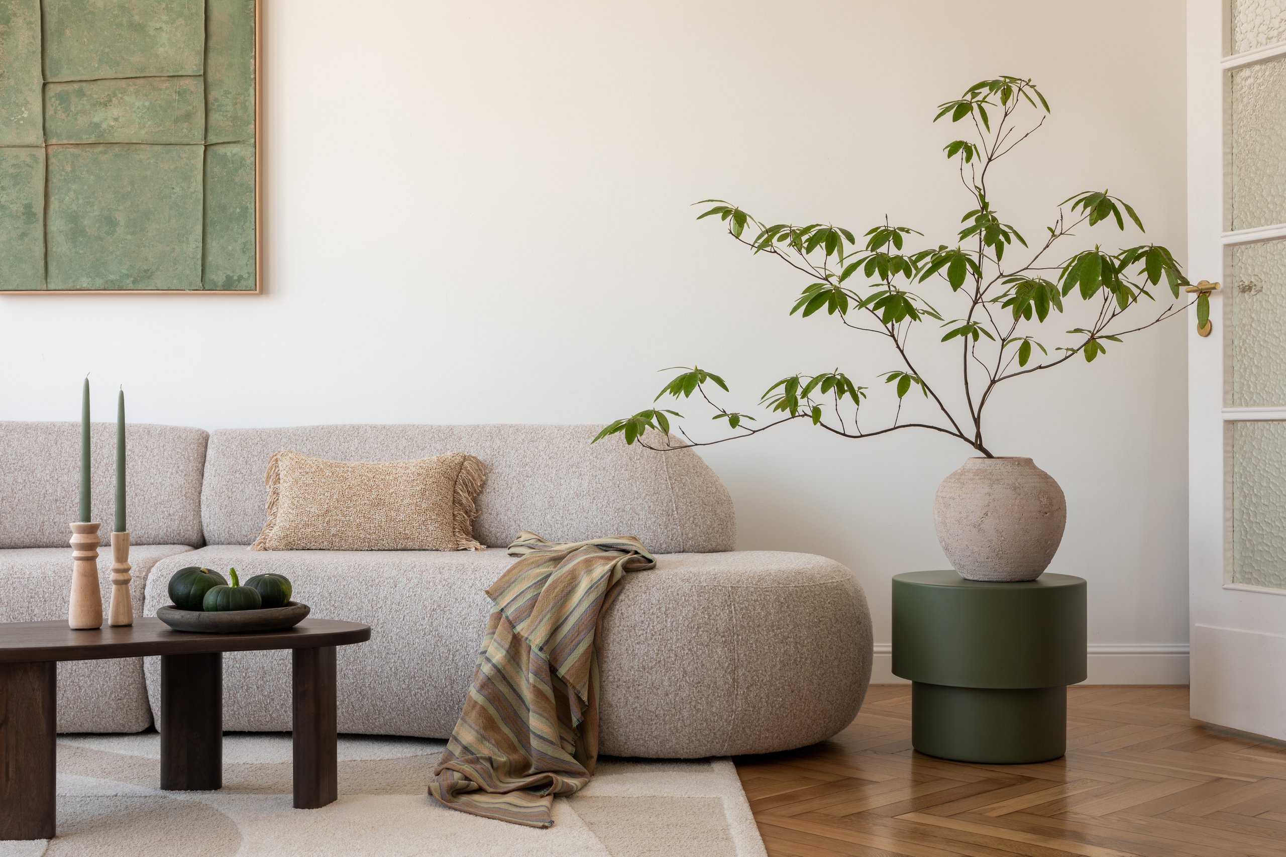 Stylish modern living room with minimalist decor in earthy tones