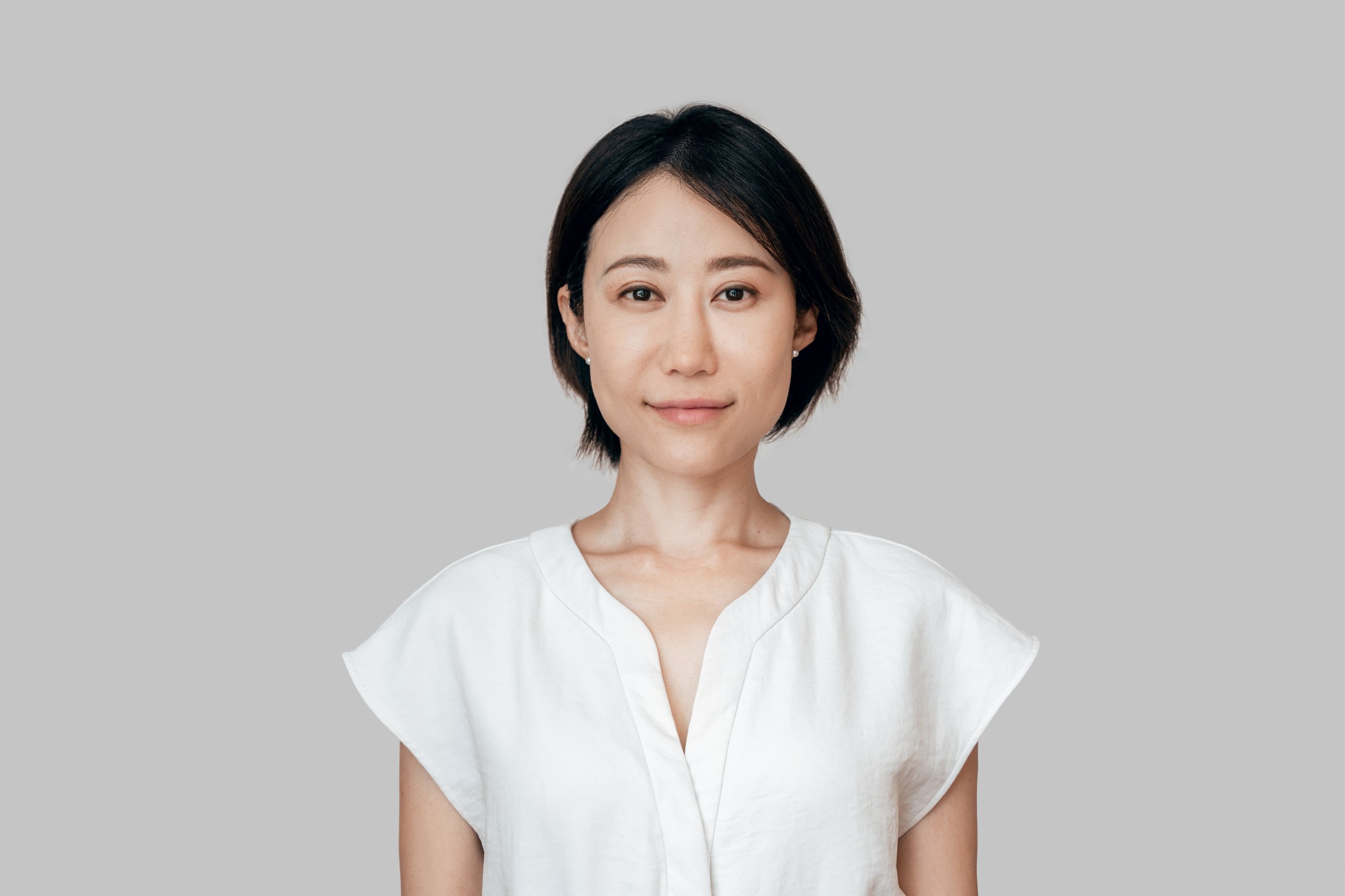Isolated headshot closeup portrait of confident mature female businesswoman