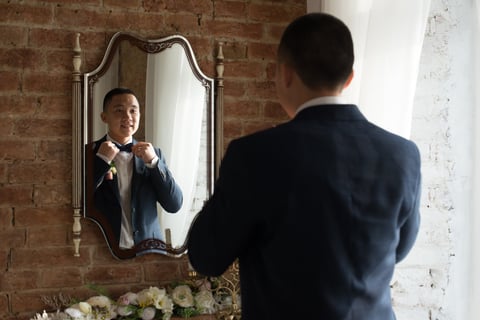 Groom in mirror