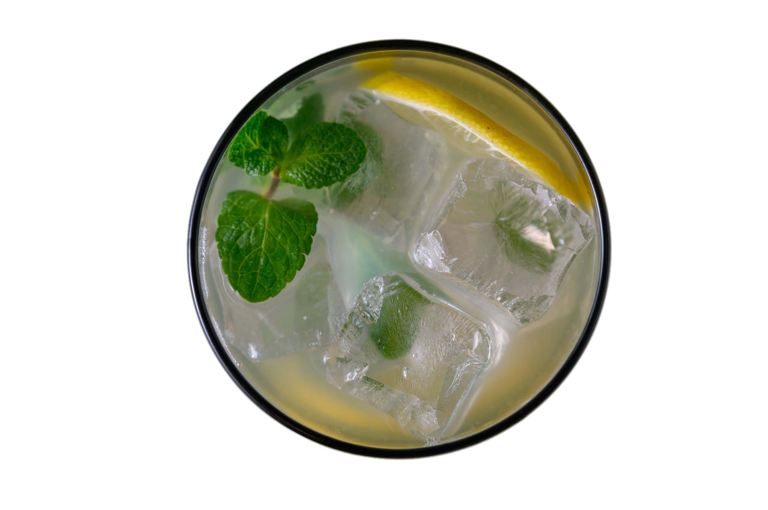 Clean overhead shot of authentic Cuban mojito cocktail with muddled mint and lime