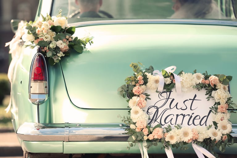 Vintage getaway car with Just Married sign