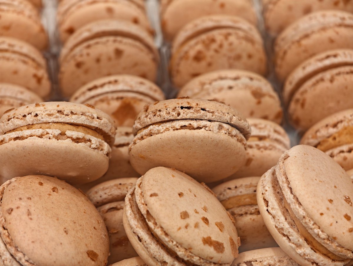 Close up of stacked brown macarons dessert