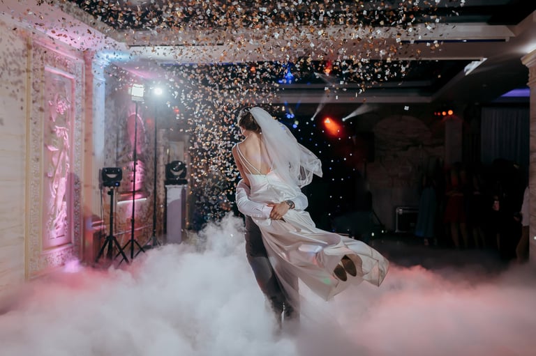Bride and groom dancing with confetti
